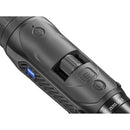 Close-up of a black Zeiss DJ 6 binocular scope showing the textured grip, adjustment dial, and a blue Zeiss logo badge.